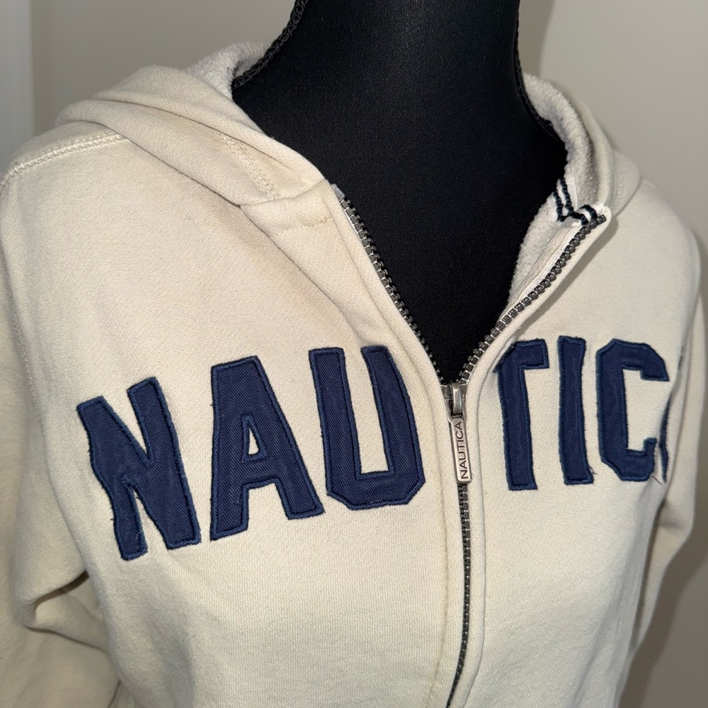 Cream Nautica Hoodie with bold, stitched, navy “NAUTICA” lettering across the ch - Picture 3 of 7